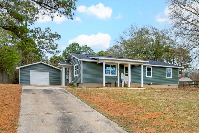 front view of a house with a yard