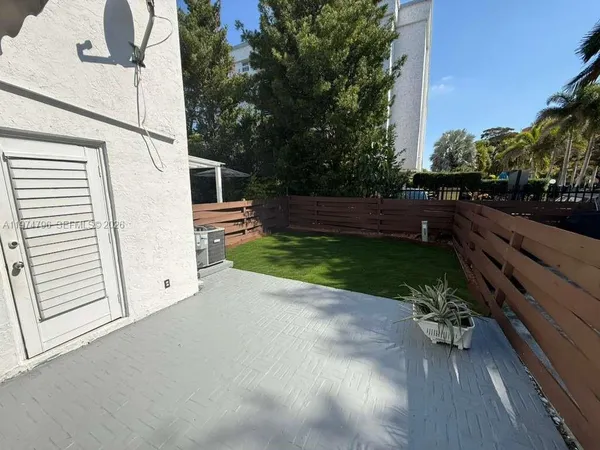 a view of backyard and entertaining space