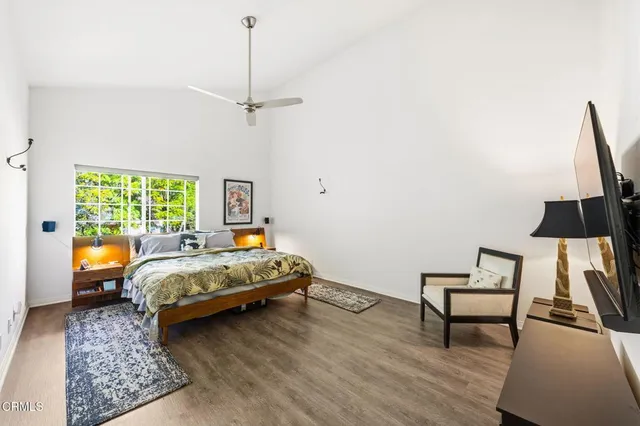 a bedroom with bed and window