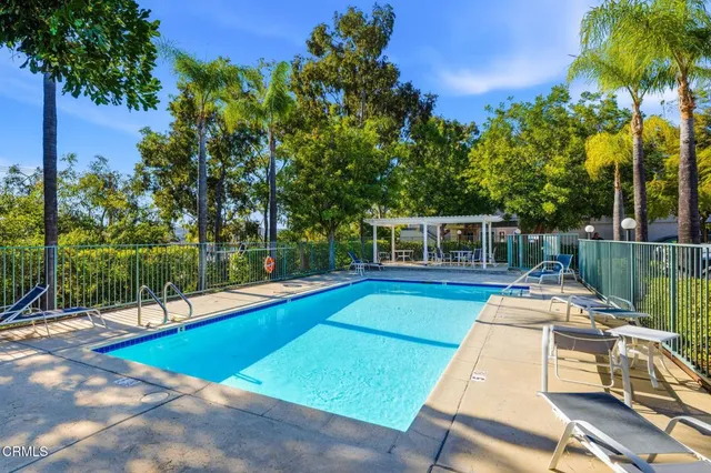 a view of a patio with swimming pool