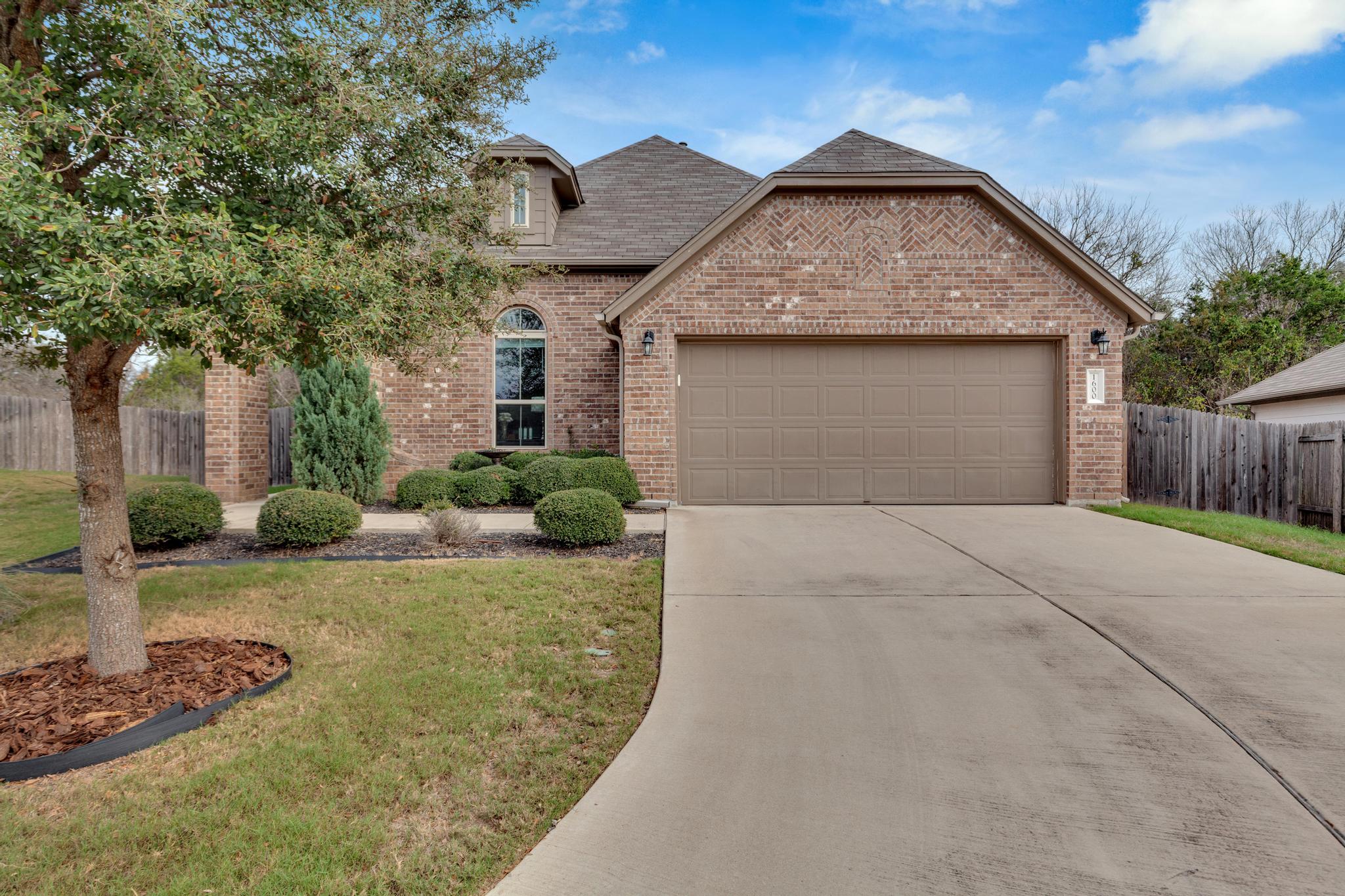 1600 Koala Street Manchaca, TX 78652 - Photo 1 of 1 a view of a house with a yard
