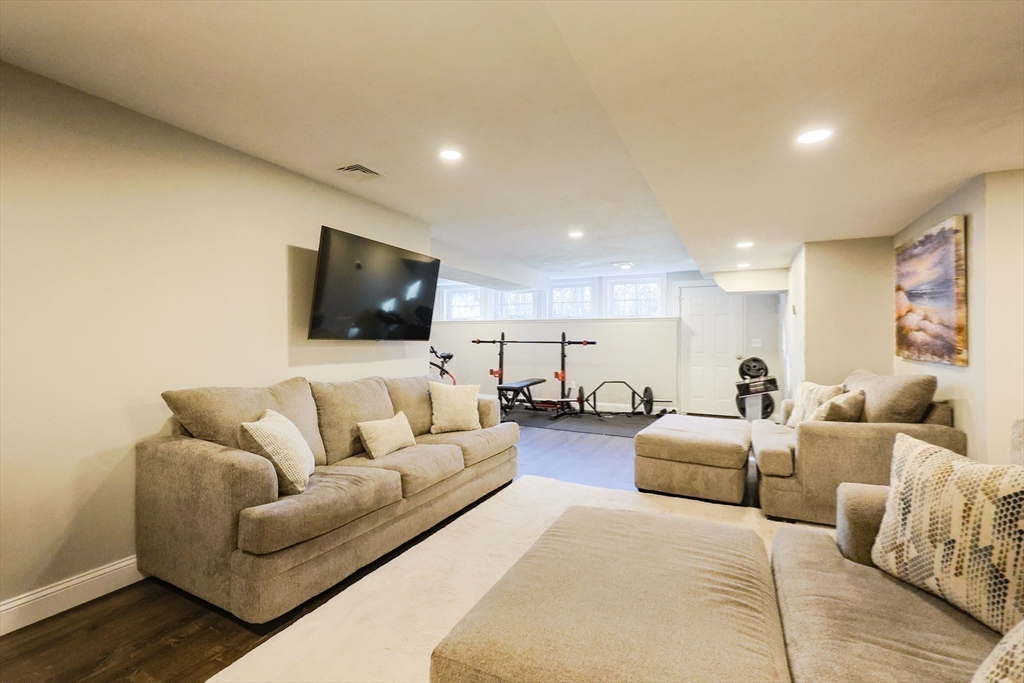 175 A Glenwood Road Rutland, MA 01543 - Photo 25 of 41 a living room with furniture and a flat screen tv
