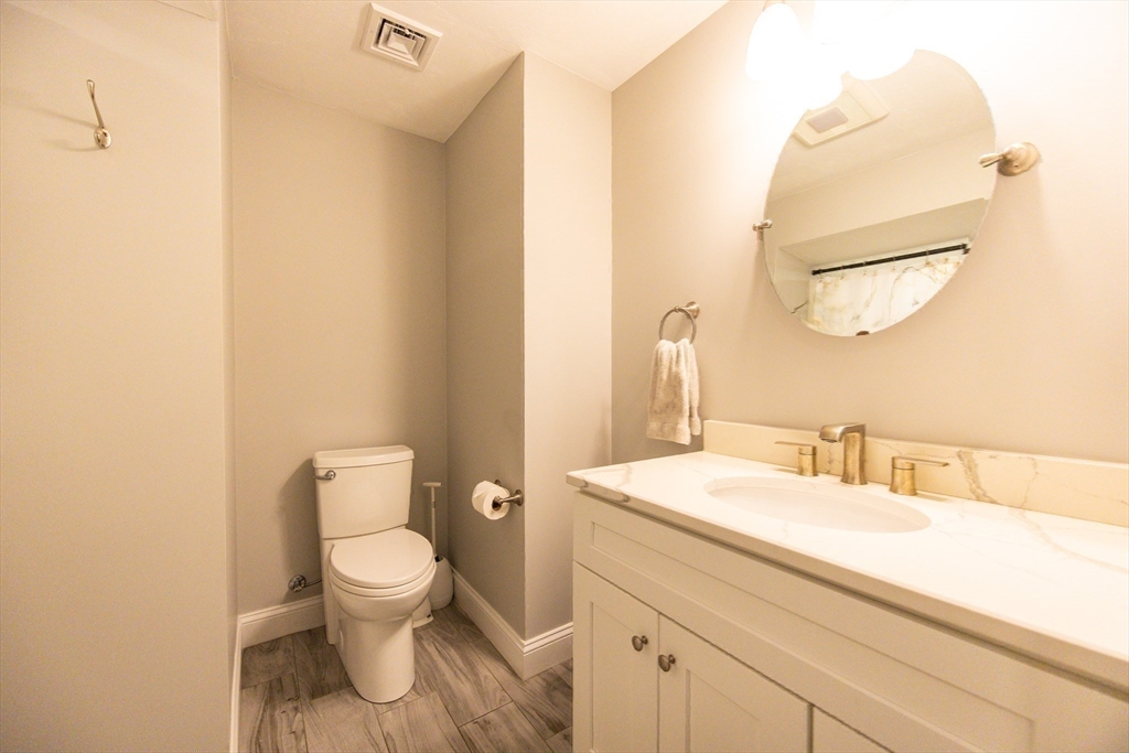 175 A Glenwood Road Rutland, MA 01543 - Photo 30 of 41 a bathroom with a toilet sink and mirror