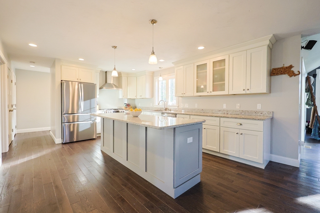 175 A Glenwood Road Rutland, MA 01543 - Photo 4 of 41 a kitchen with white cabinets and stainless steel appliances