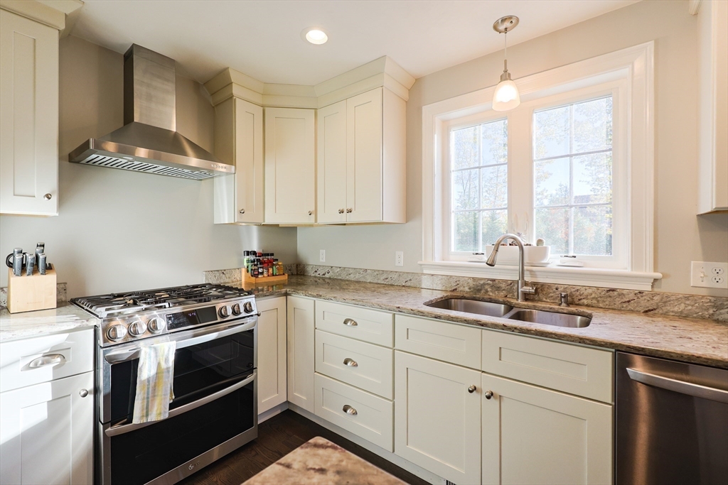 175 A Glenwood Road Rutland, MA 01543 - Photo 6 of 41 a kitchen with stainless steel appliances granite countertop white cabinets and window