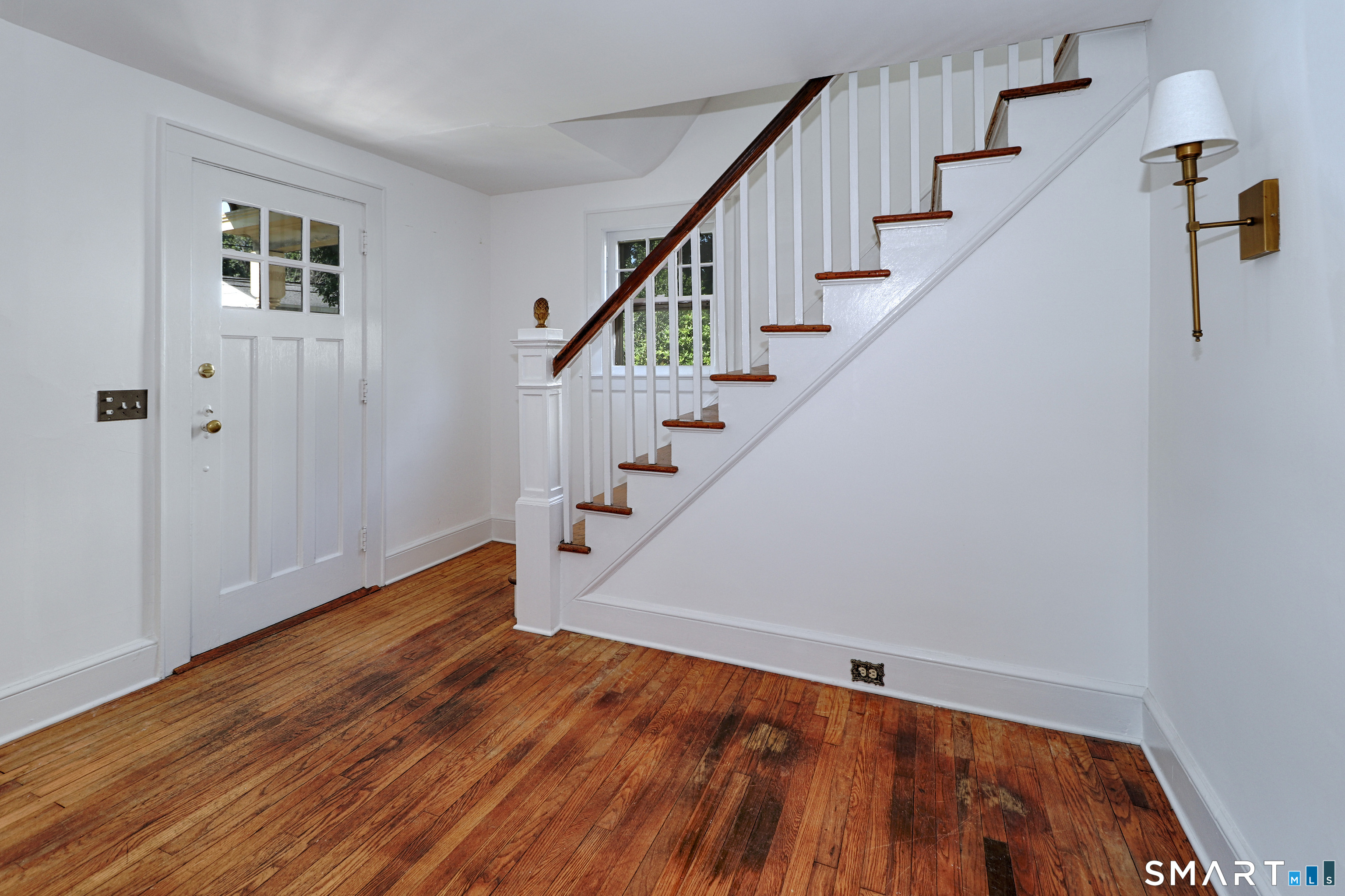 104 Henderson Road Fairfield, CT 06824 - Photo 3 of 26 Entry way with stairs to upper level.