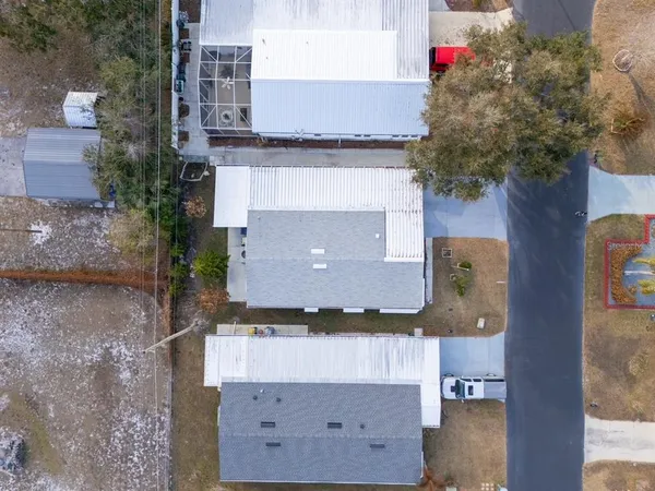 an aerial view of house with yard