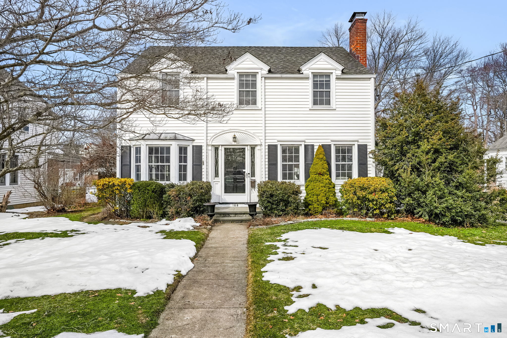 188 Henderson Road Fairfield, CT 06824 - Photo 1 of 38 a view of a white house with a yard