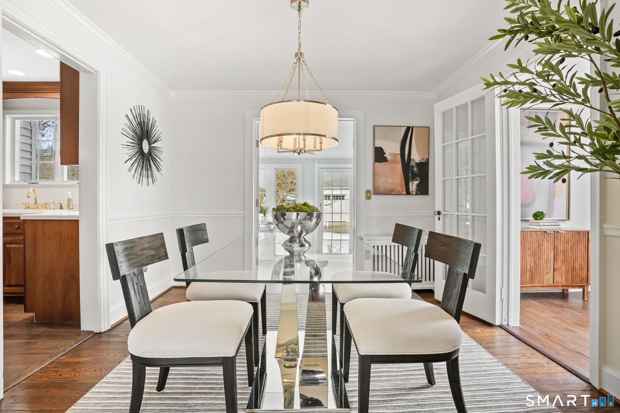 188 Henderson Road Fairfield, CT 06824 - Photo 11 of 38 a view of a dining room with furniture window and wooden floor