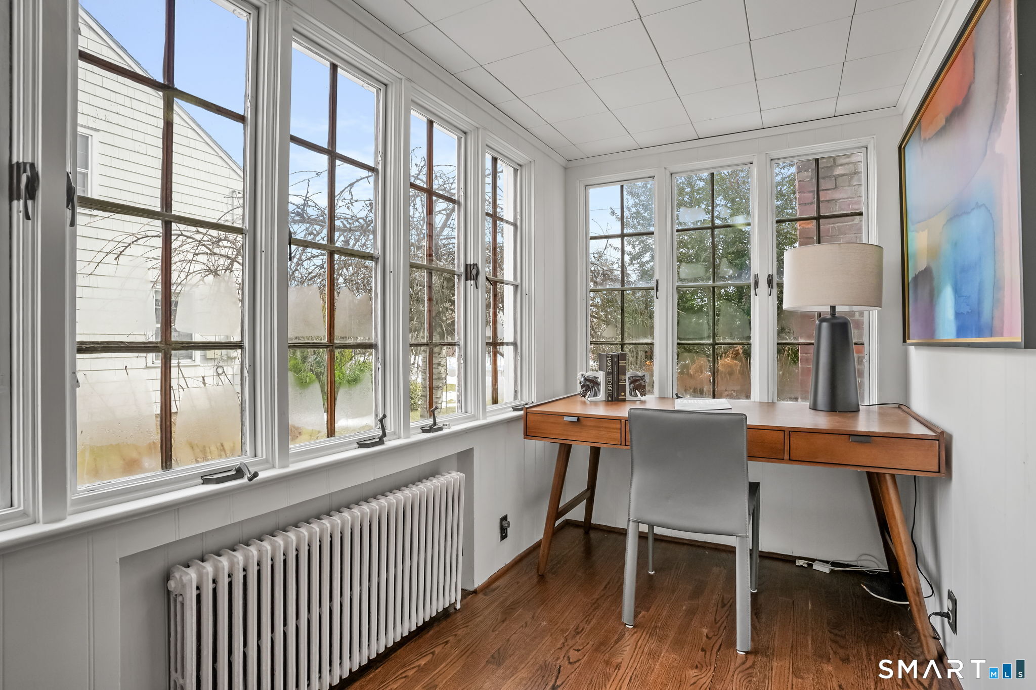 188 Henderson Road Fairfield, CT 06824 - Photo 14 of 38 a dining room with furniture and wooden floor