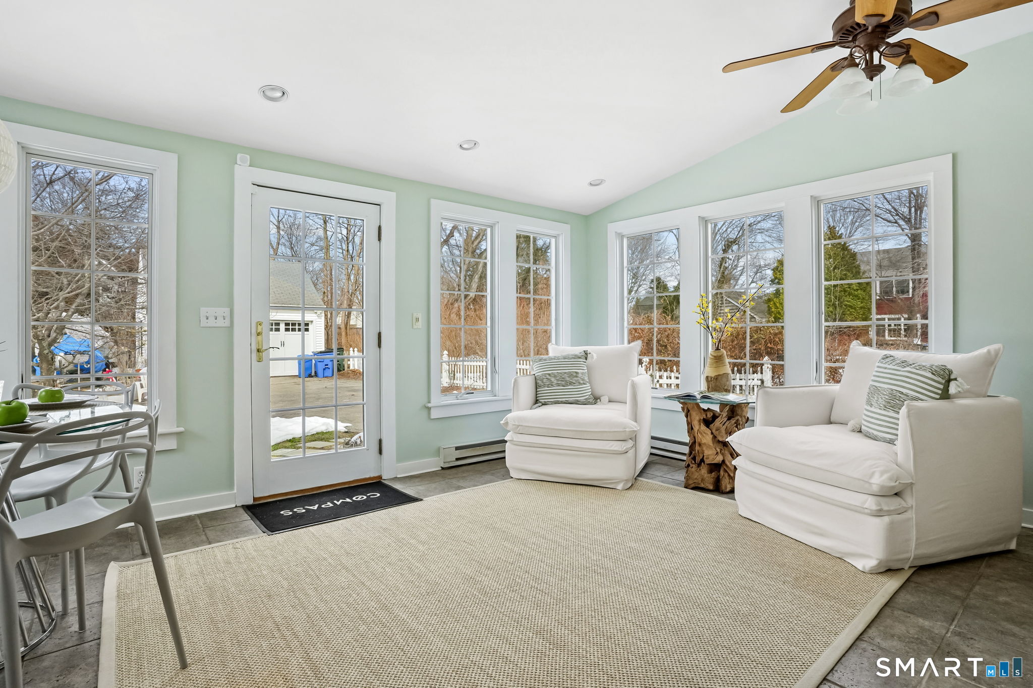 188 Henderson Road Fairfield, CT 06824 - Photo 15 of 38 a living room with furniture and a large window