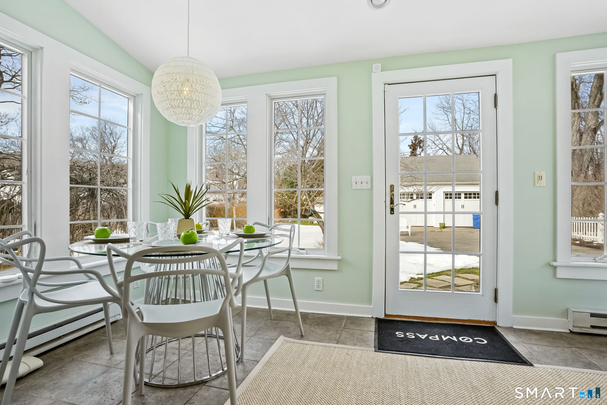 188 Henderson Road Fairfield, CT 06824 - Photo 16 of 38 a living room with furniture and a large window