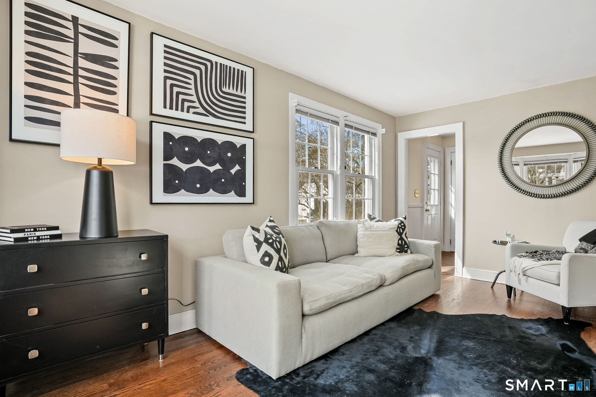 188 Henderson Road Fairfield, CT 06824 - Photo 6 of 38 a living room with furniture and a window