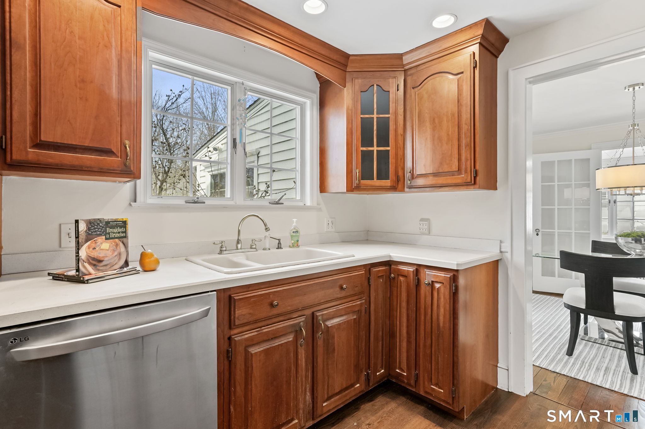 188 Henderson Road Fairfield, CT 06824 - Photo 10 of 38 a kitchen with a sink cabinets and window