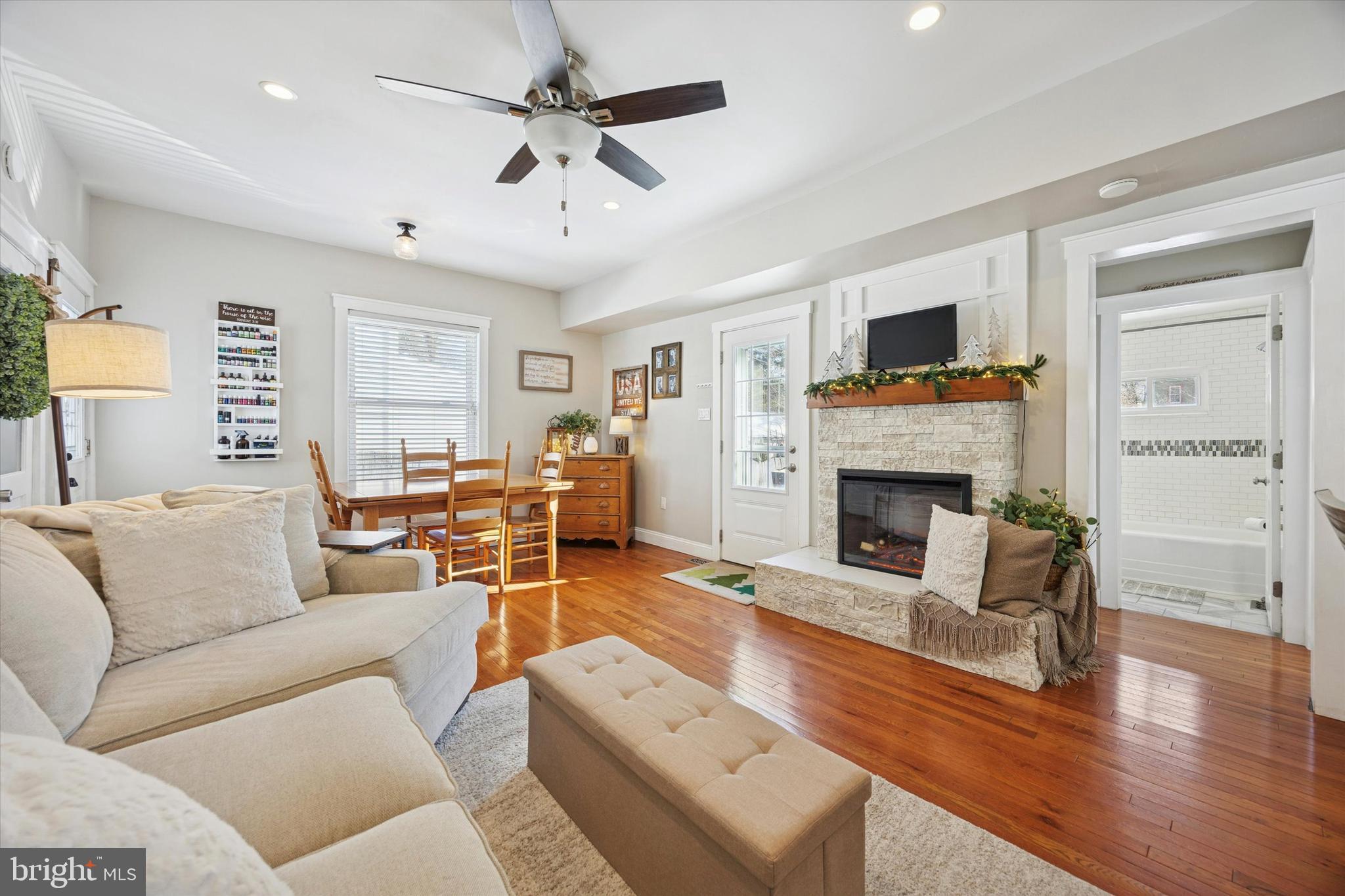 55 Kenton Avenue Pitman, NJ 08071 - Photo 11 of 26 a living room with furniture a fireplace and a flat screen tv