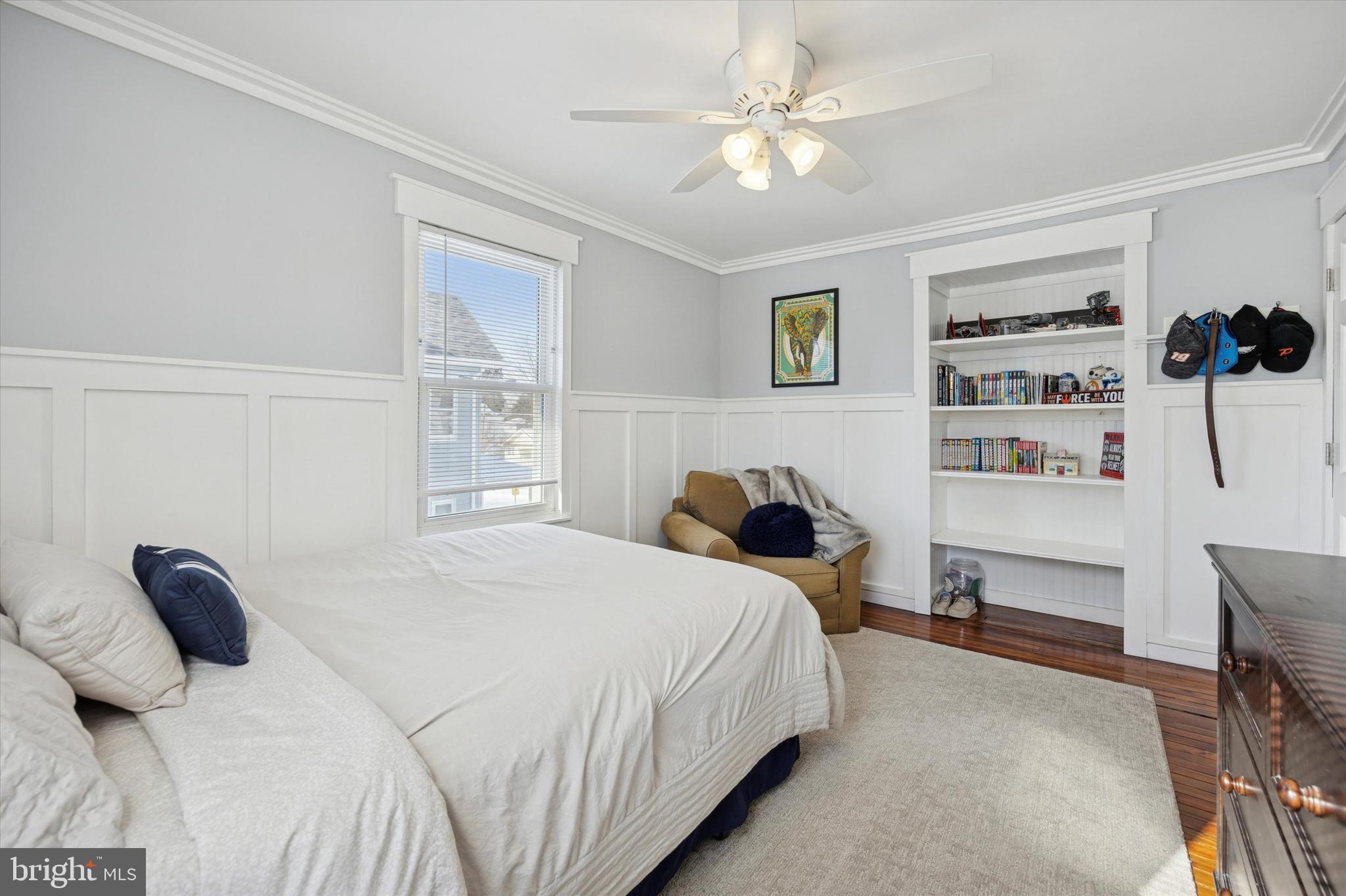 55 Kenton Avenue Pitman, NJ 08071 - Photo 18 of 26 a bedroom with a bed and a book shelf