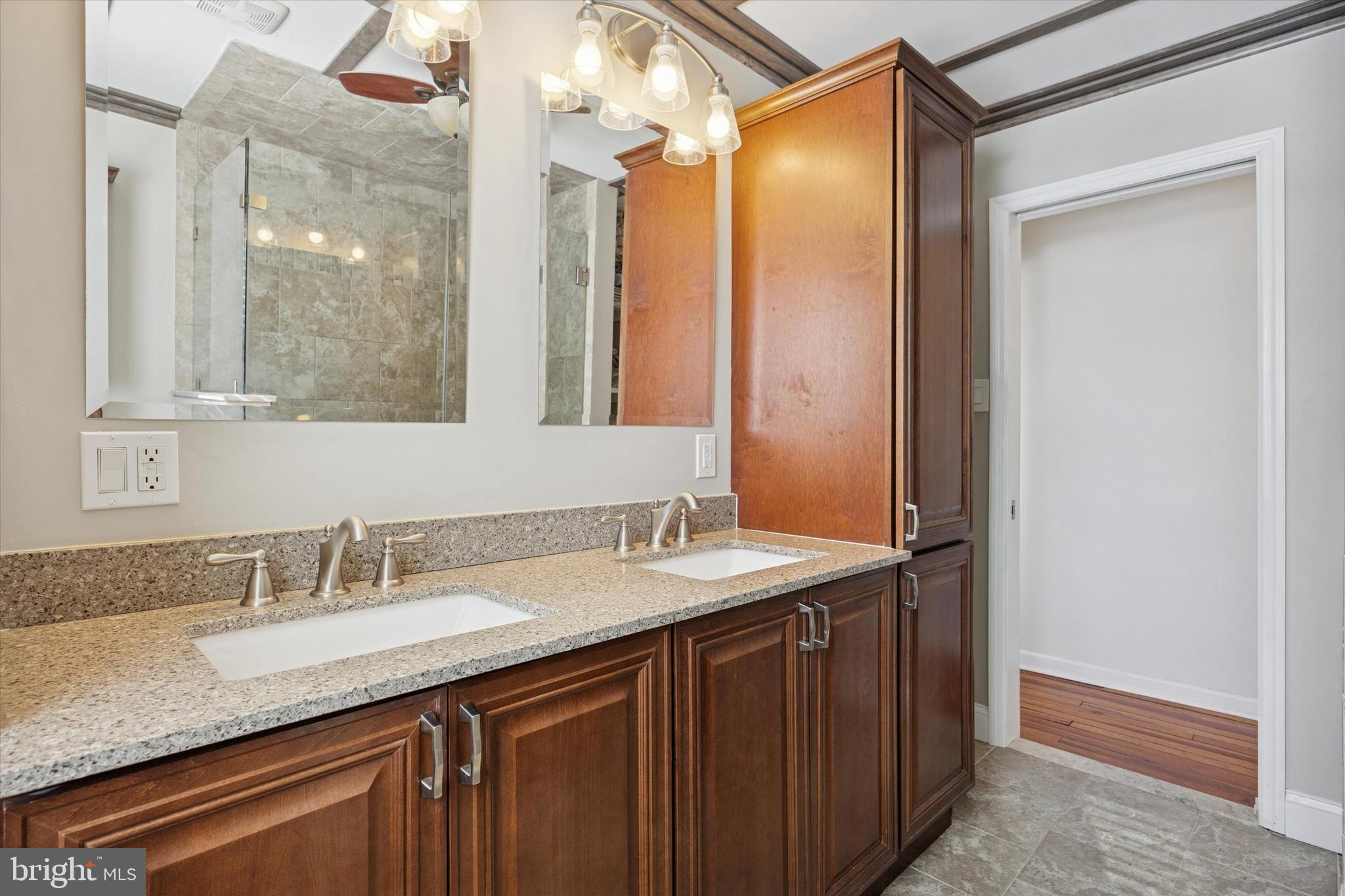 55 Kenton Avenue Pitman, NJ 08071 - Photo 19 of 26 a bathroom with a granite countertop sink and a mirror