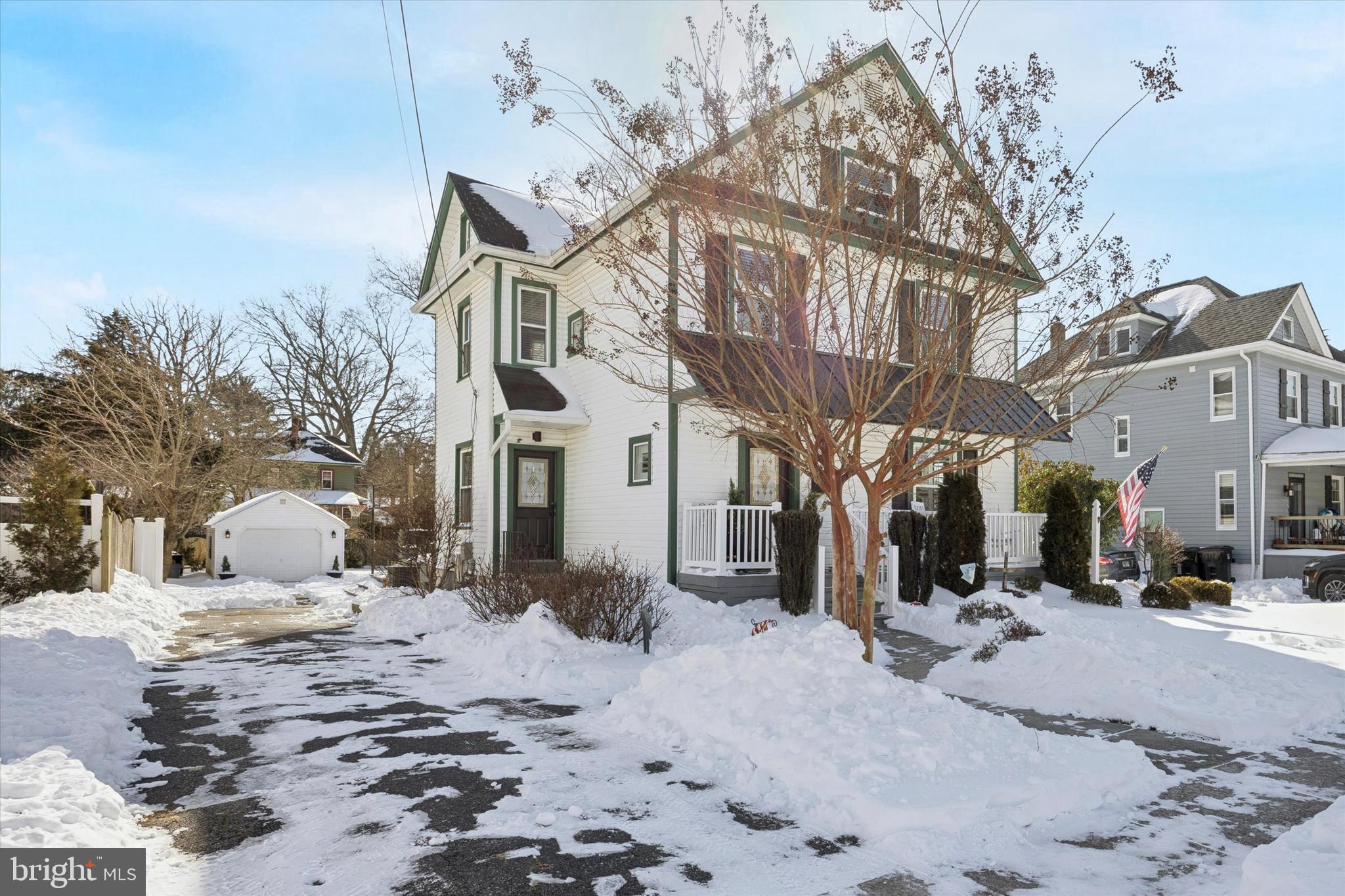 55 Kenton Avenue Pitman, NJ 08071 - Photo 3 of 26 a view of a road with a building in the background