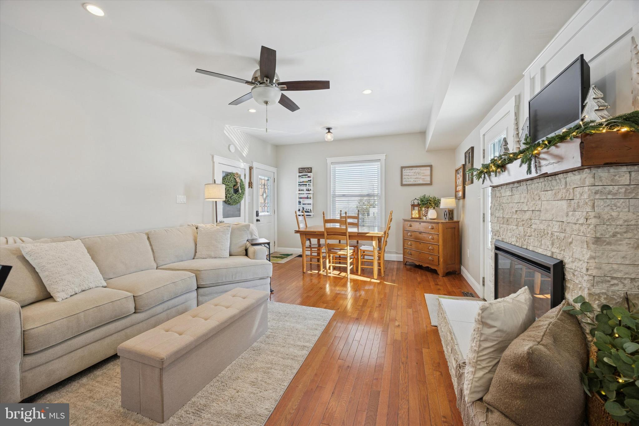 55 Kenton Avenue Pitman, NJ 08071 - Photo 10 of 26 a living room with furniture and a fireplace