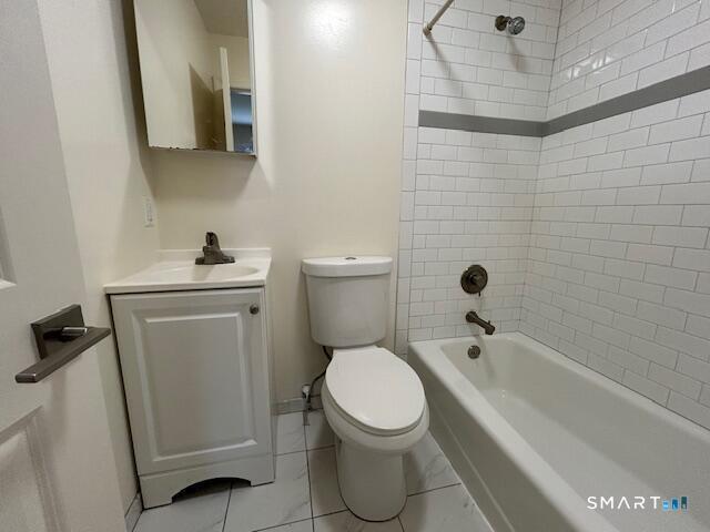 34 Prospect Street, Unit 4M Norwalk, CT 06850 - Photo 4 of 7 a bathroom with a sink a toilet and shower