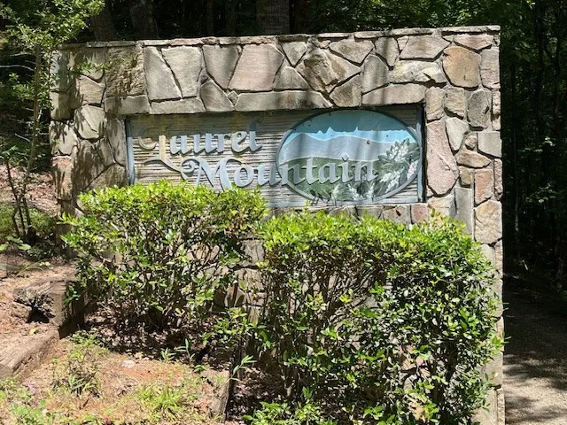 a view of a wooden door and a street sign
