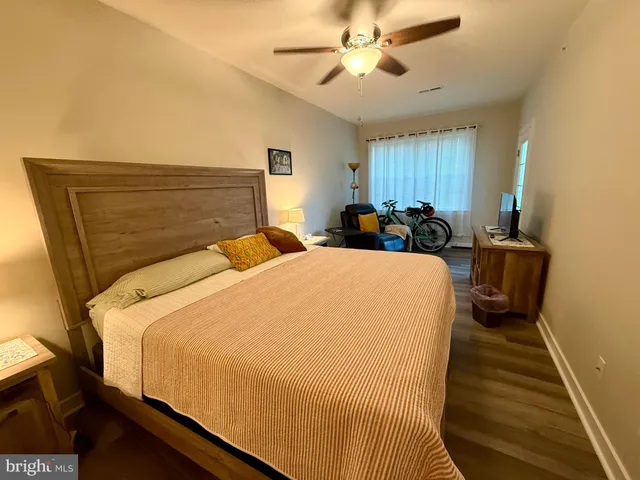 a bed room with a bed and a chandelier