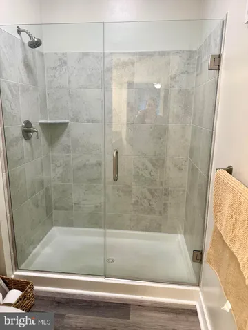 a bathroom with a shower and bathtub
