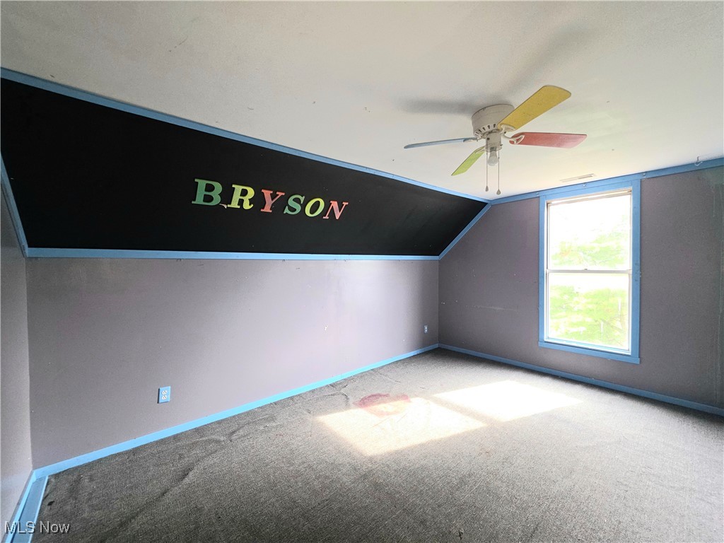 10 Browns Ridge Road Rockport, WV 26169 - Photo 15 of 35 Additional living space with lofted ceiling, carpet floors, and a ceiling fan