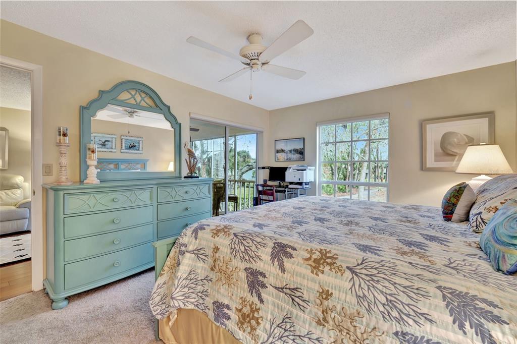 5248 Marsh Field Road, Unit 2 Sarasota, FL 34235 - Photo 12 of 30 a bedroom with a large bed and a window