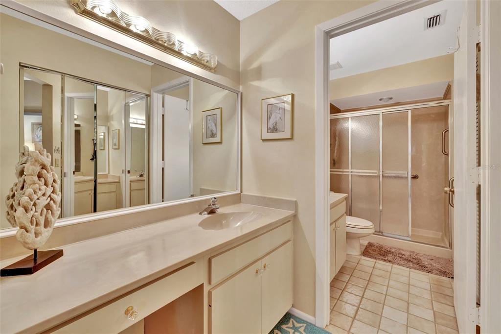 5248 Marsh Field Road, Unit 2 Sarasota, FL 34235 - Photo 14 of 30 a bathroom with a sink a toilet a mirror and shower