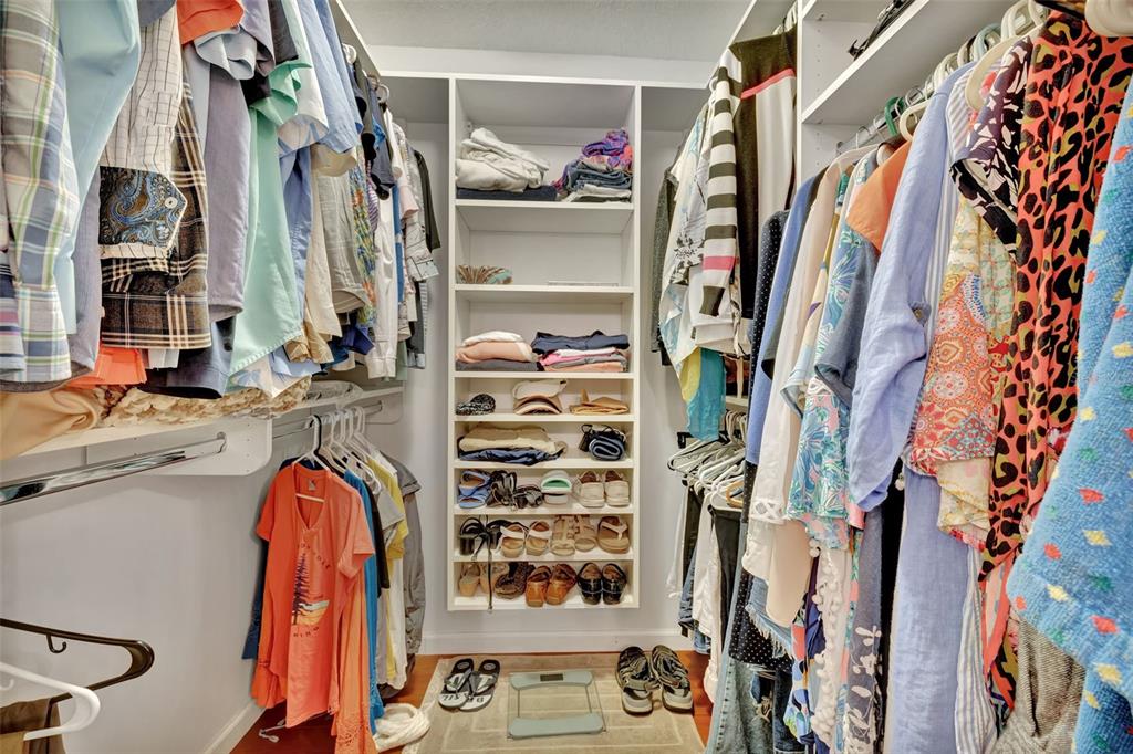 5248 Marsh Field Road, Unit 2 Sarasota, FL 34235 - Photo 16 of 30 a view of walk in closet with clothes and shoes