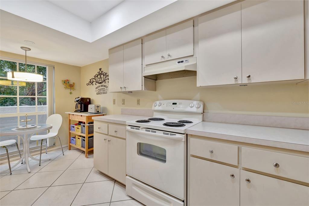 5248 Marsh Field Road, Unit 2 Sarasota, FL 34235 - Photo 19 of 30 a kitchen with cabinets appliances a sink and a stove