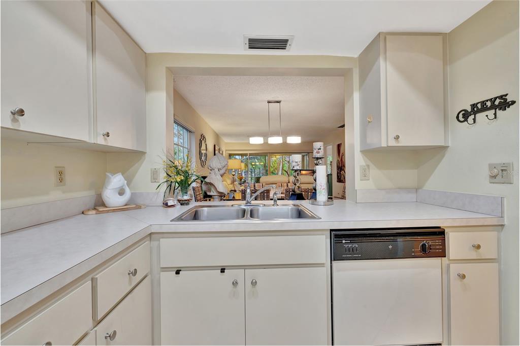 5248 Marsh Field Road, Unit 2 Sarasota, FL 34235 - Photo 21 of 30 a kitchen with a sink and cabinets