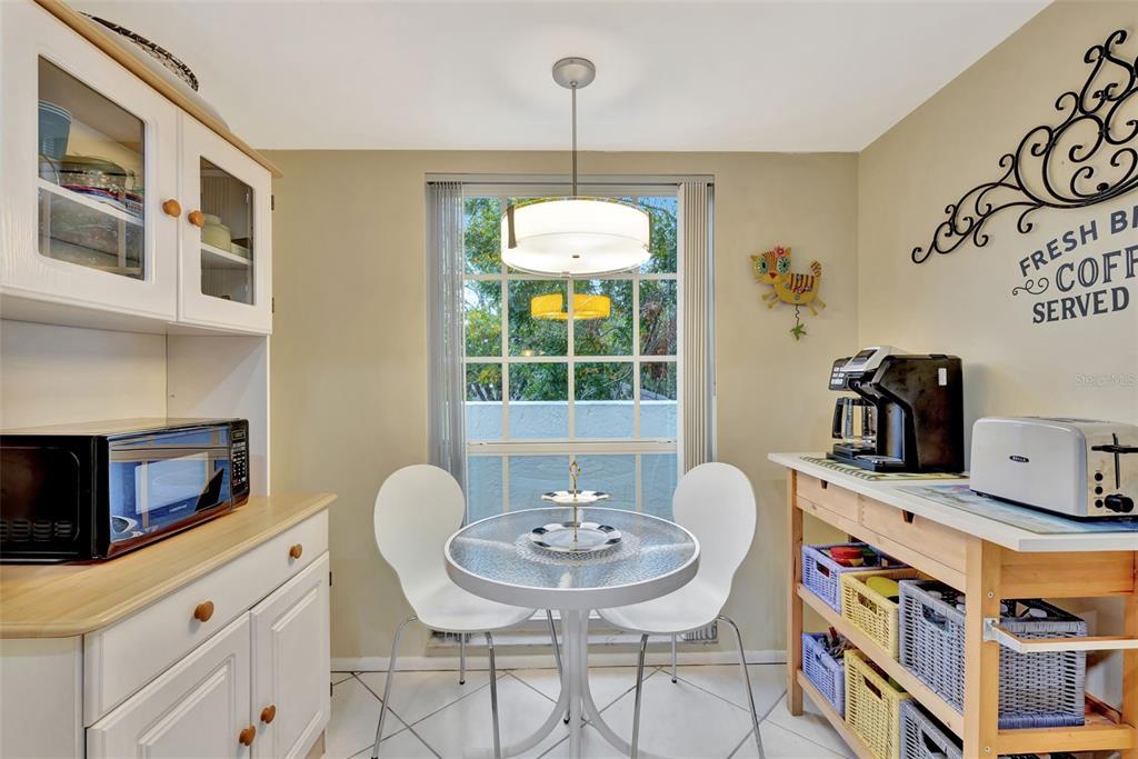 5248 Marsh Field Road, Unit 2 Sarasota, FL 34235 - Photo 22 of 30 a dining room with furniture and window