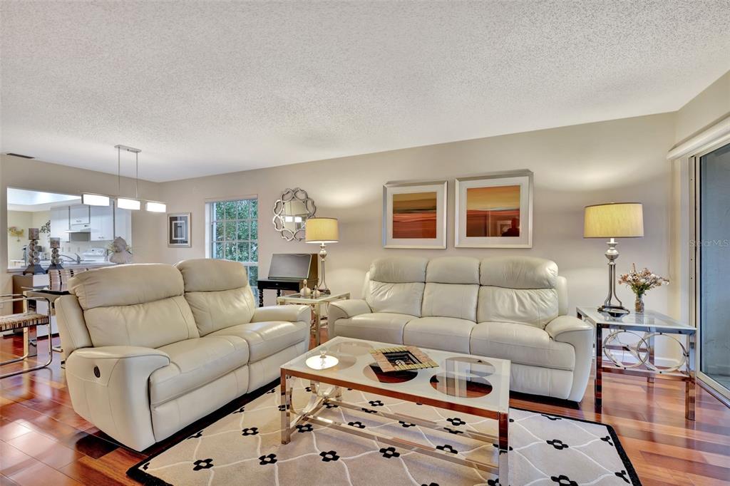 5248 Marsh Field Road, Unit 2 Sarasota, FL 34235 - Photo 9 of 30 a living room with furniture and painting on the wall