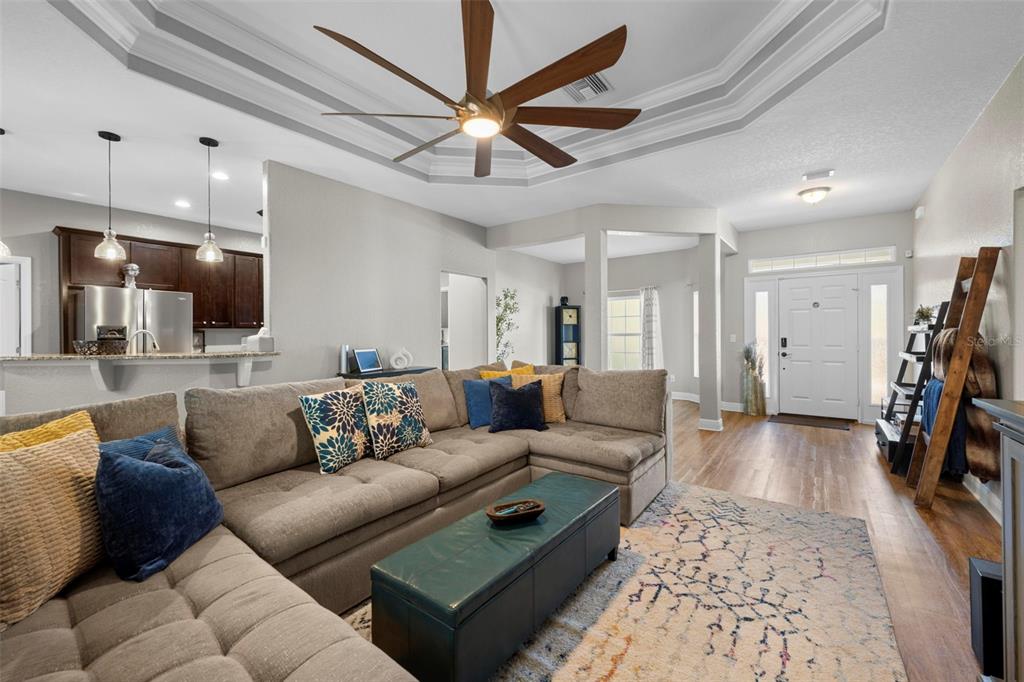 8104 Nightingale Road Weeki Wachee, FL 34613 - Photo 13 of 45 a living room with furniture and a wooden floor
