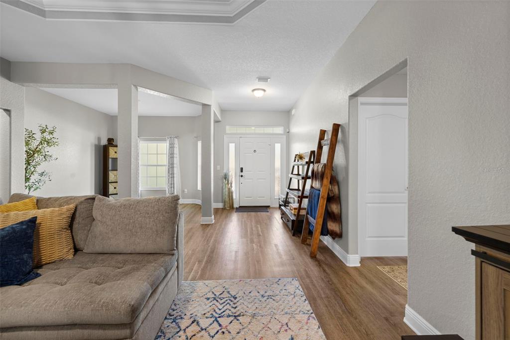 8104 Nightingale Road Weeki Wachee, FL 34613 - Photo 14 of 45 a living room with furniture and a wooden floor