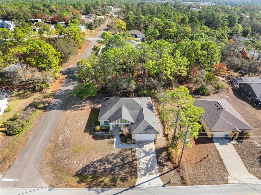 8104 Nightingale Road Weeki Wachee, FL 34613 - Photo 19 of 45 an aerial view of a house with a yard and sitting area