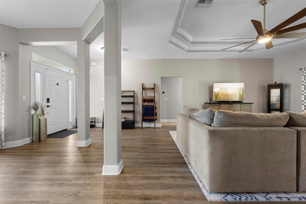 8104 Nightingale Road Weeki Wachee, FL 34613 - Photo 27 of 45 a living room with furniture and a flat screen tv