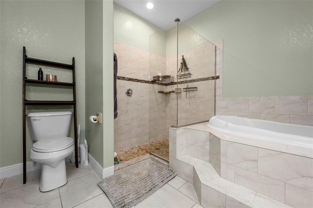 8104 Nightingale Road Weeki Wachee, FL 34613 - Photo 34 of 45 a bathroom with a sink a toilet and shower