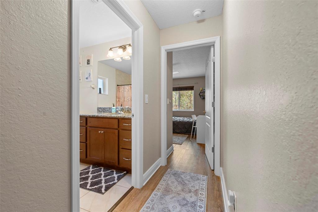8104 Nightingale Road Weeki Wachee, FL 34613 - Photo 37 of 45 a view of a bathroom from the hallway