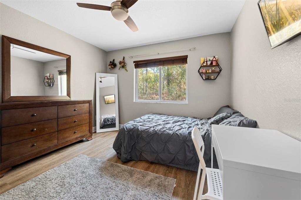 8104 Nightingale Road Weeki Wachee, FL 34613 - Photo 39 of 45 a bedroom with a bed and a dresser