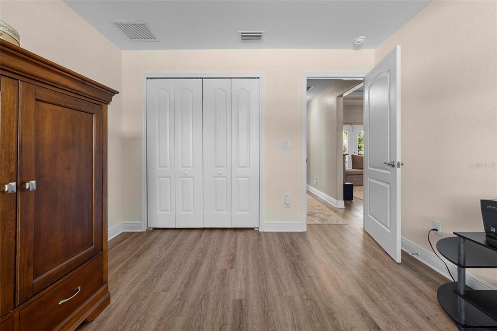 8104 Nightingale Road Weeki Wachee, FL 34613 - Photo 43 of 45 a view of hallway with wooden floor