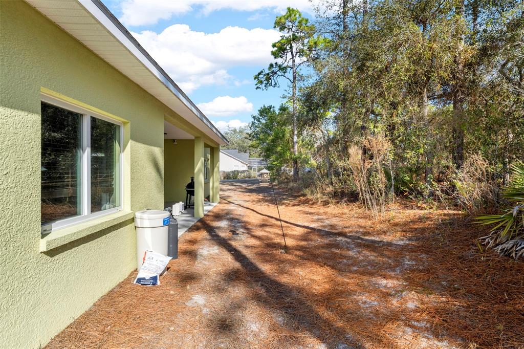 8104 Nightingale Road Weeki Wachee, FL 34613 - Photo 45 of 45 a view of a house with backyard and sitting area