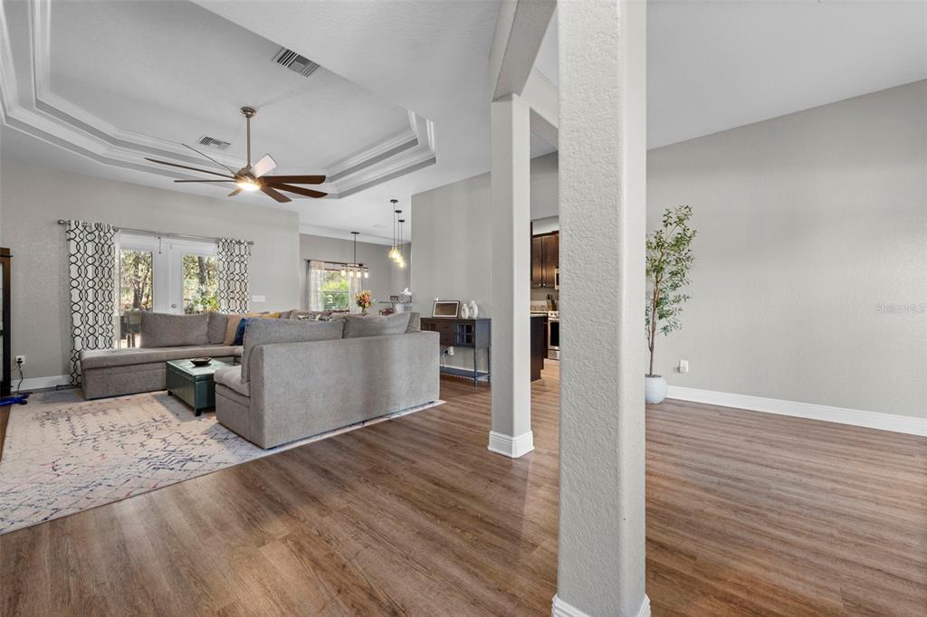 8104 Nightingale Road Weeki Wachee, FL 34613 - Photo 6 of 45 a view of a kitchen with wooden floor