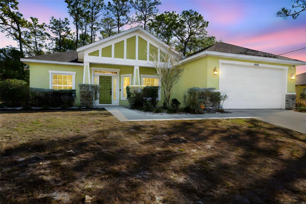 8104 Nightingale Road Weeki Wachee, FL 34613 - Photo 10 of 45 a front view of a house with a yard