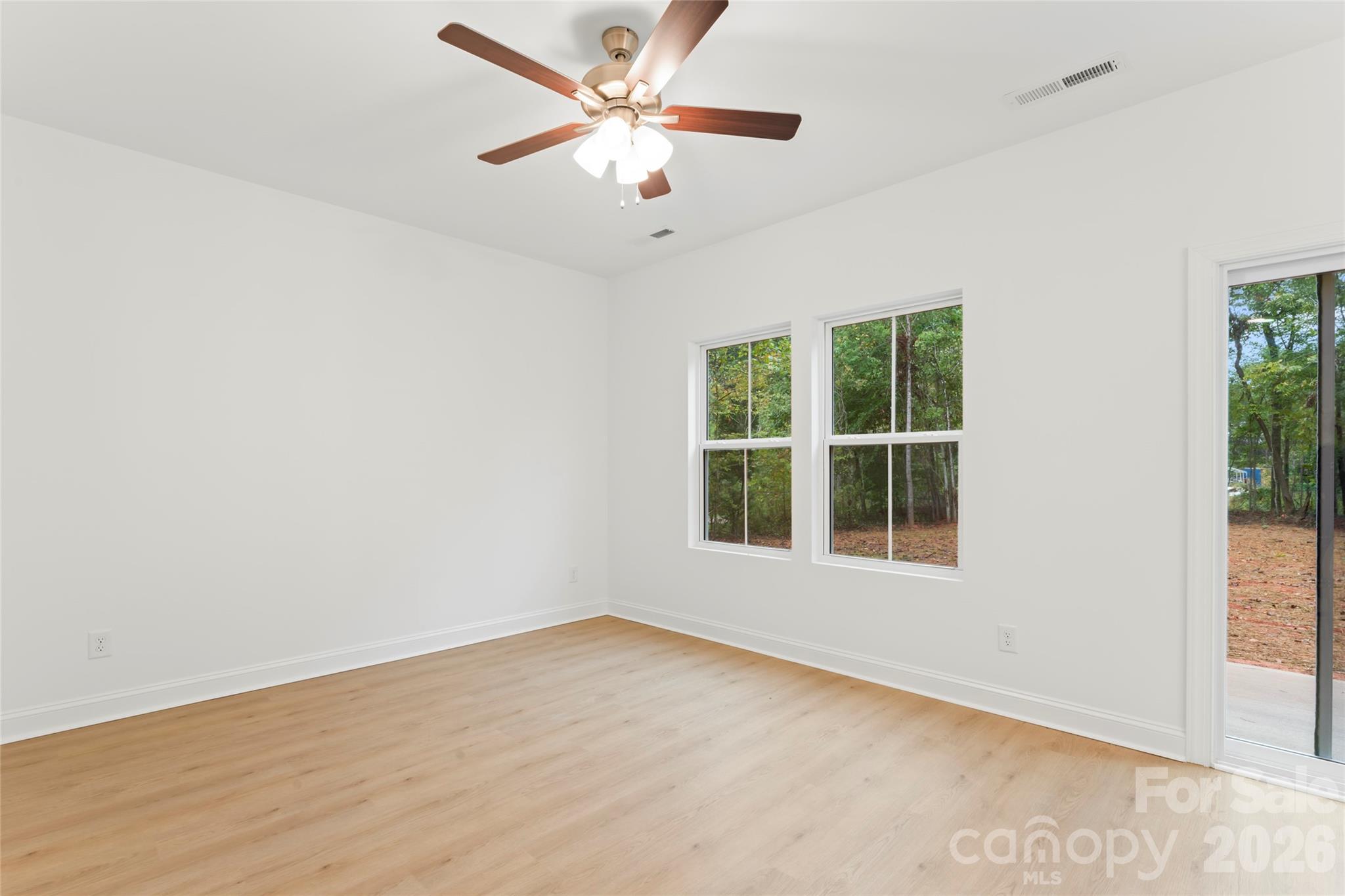 192 Doolie Road Mooresville, NC 28117 - Photo 13 of 36 an empty room with a window and a fan