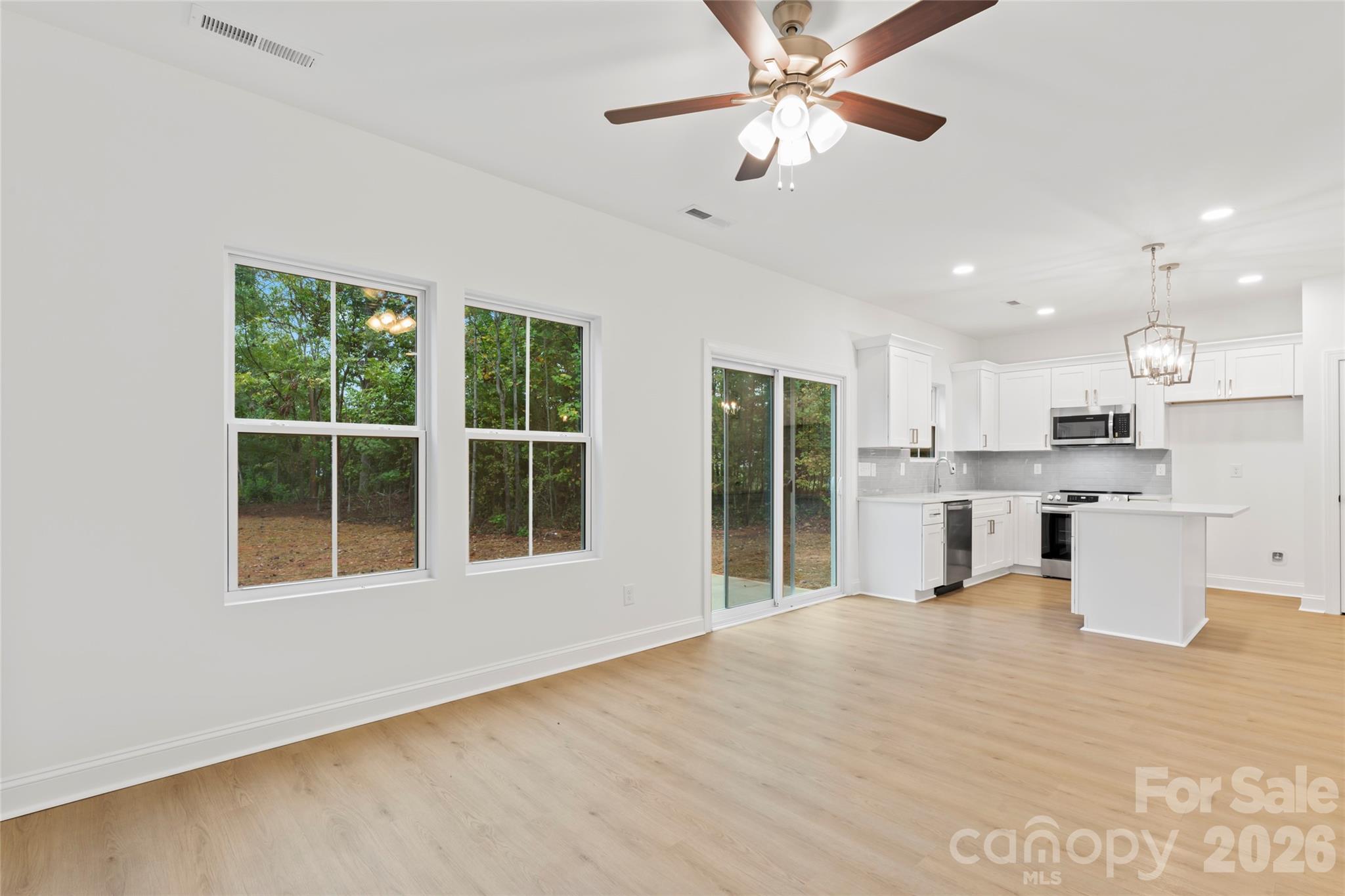 192 Doolie Road Mooresville, NC 28117 - Photo 14 of 36 a view of an empty room with a kitchen