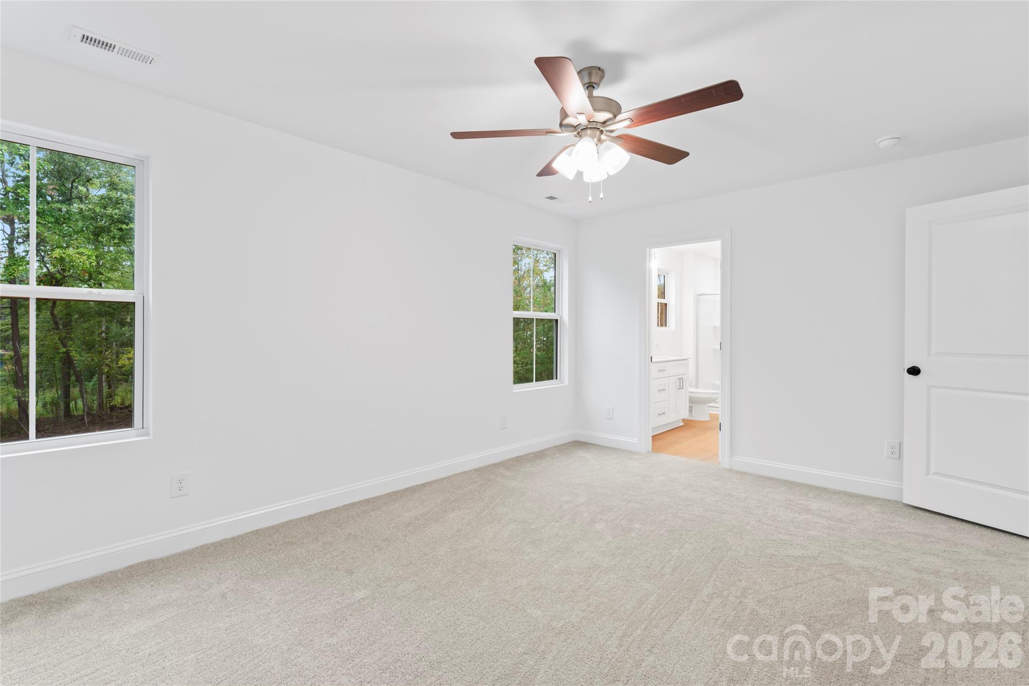 192 Doolie Road Mooresville, NC 28117 - Photo 22 of 36 an empty room with windows and fan