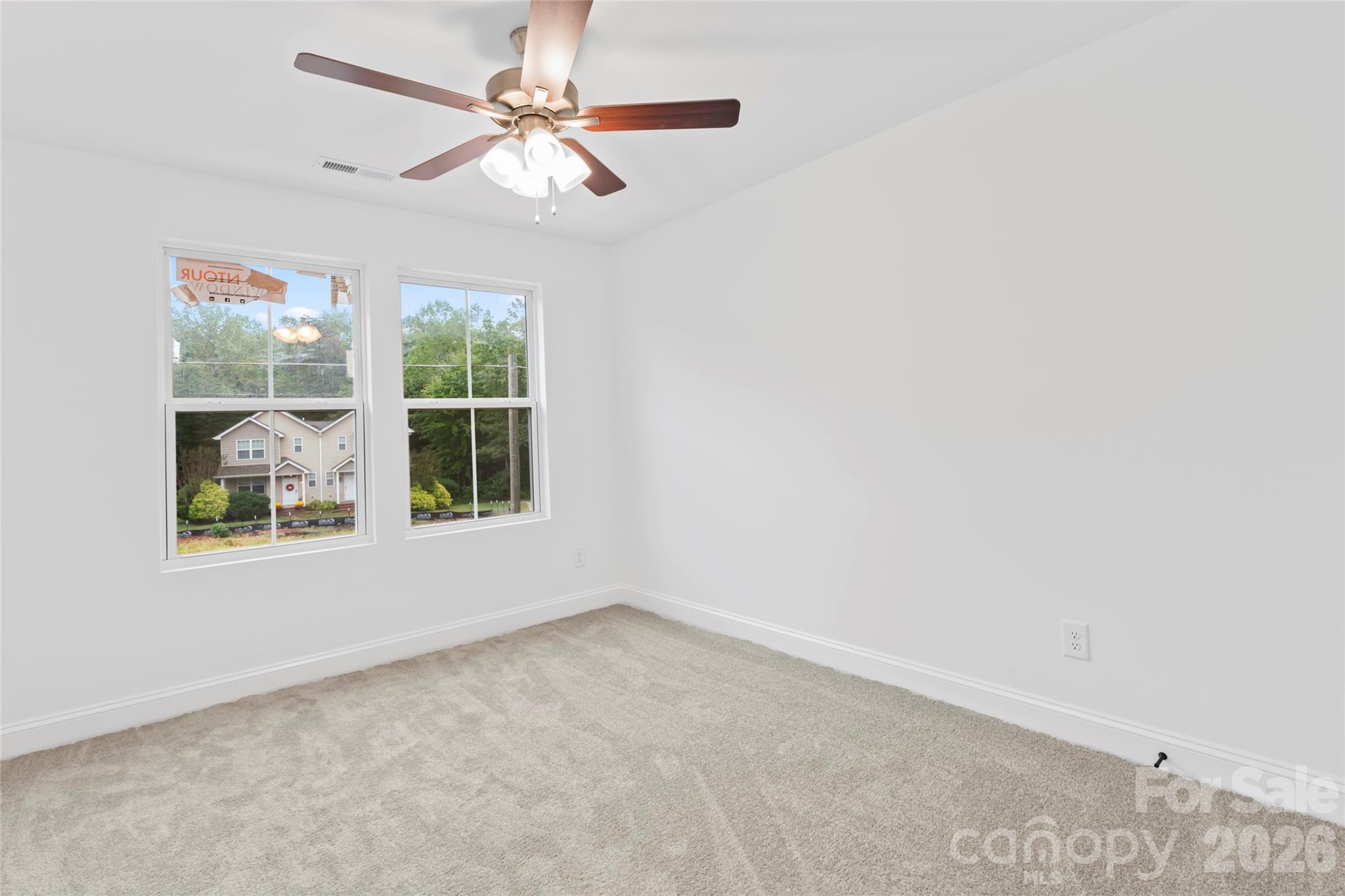 192 Doolie Road Mooresville, NC 28117 - Photo 30 of 36 an empty room with windows and fan